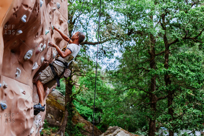 May 30, 2013 - Nainital, Uttarakhand, India: Man practices on outdoor climbing wall