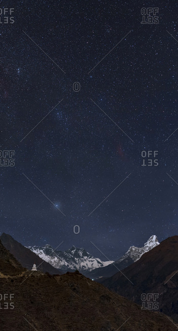 Starry sky over Mount Everest and a stupa on the Everest base camp.