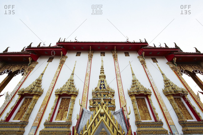 Low angle view of the Chaithararam Temple - Wat Chalong in Phuket, Thailand