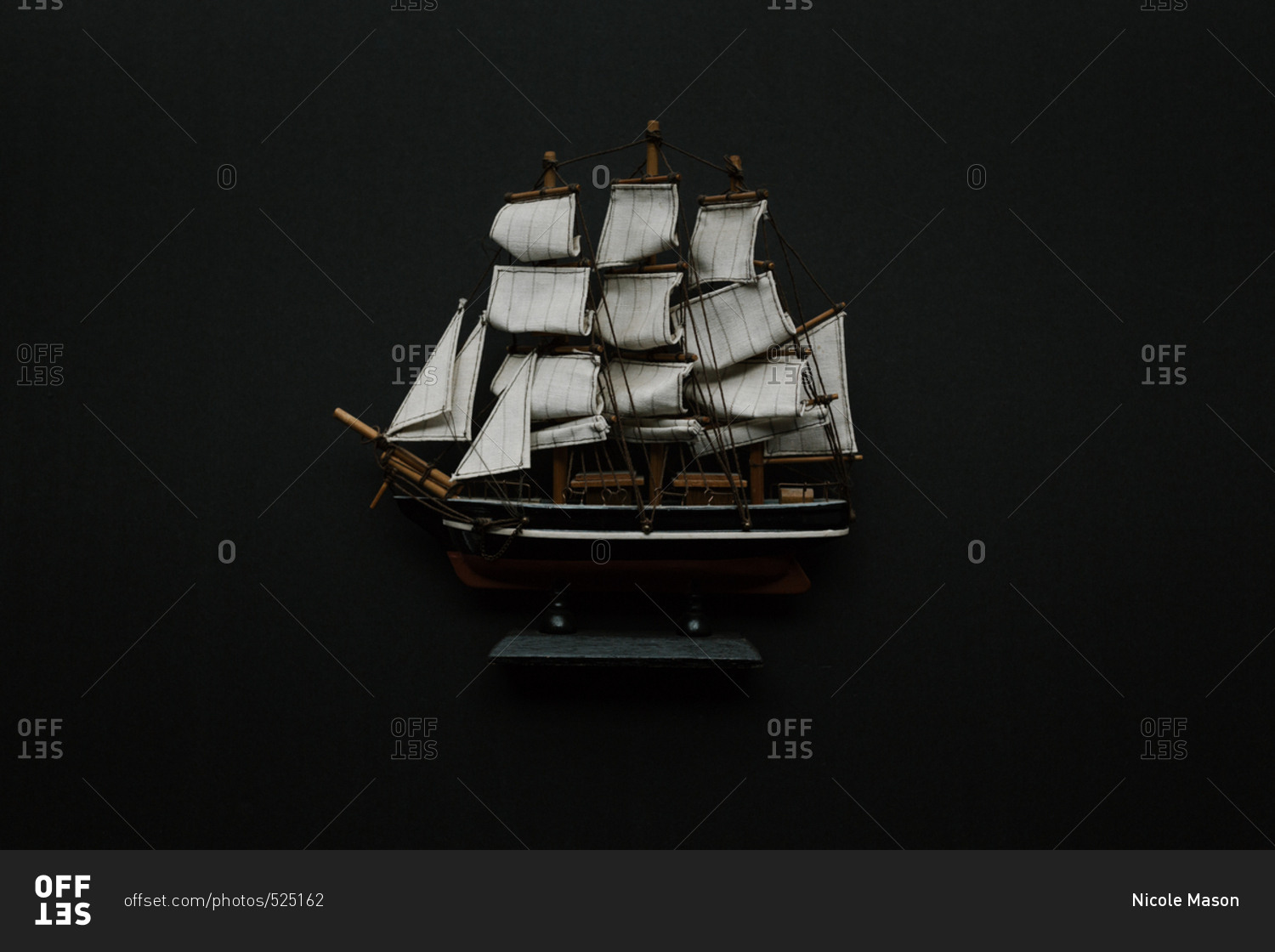 Old-fashioned model ship with sails