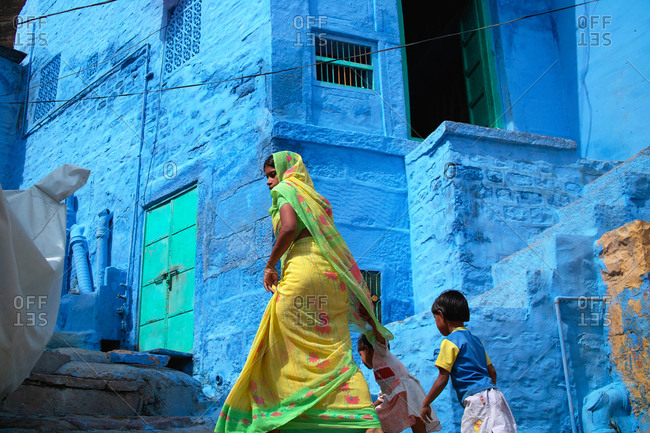 Jodhpur, India - October 19, 2009: Mom and two children in Blue City