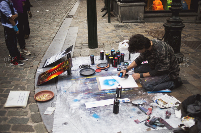 Brussels, Belgium - July 10, 2014: Street artist using spray paint