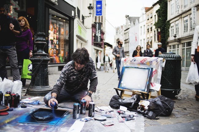 Brussels, Belgium - July 10, 2014: A street artist using spray paint