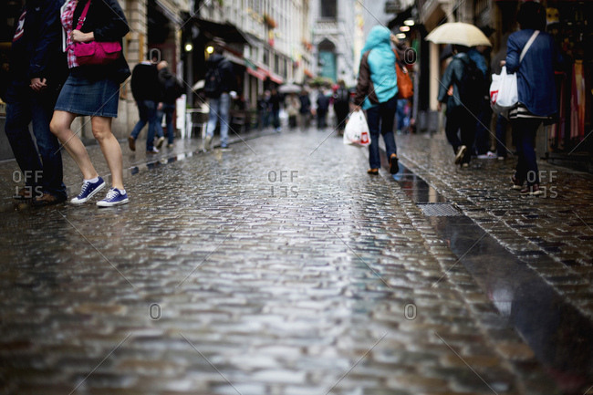 Crowds in wet street in Brussels, Belgium
