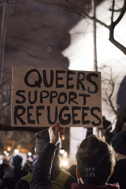 Person with a political sign at rally