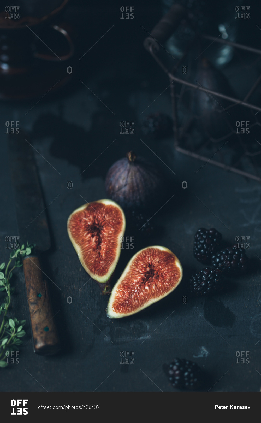Figs and blackberries in dark setting