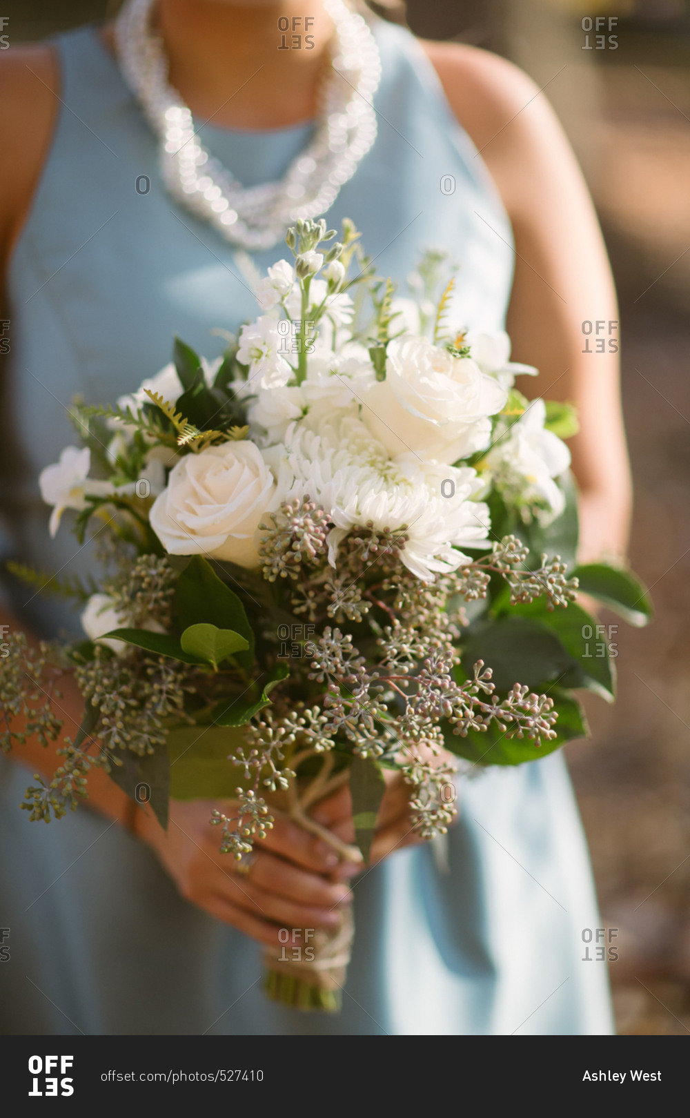 A bridesmaid with white flowers