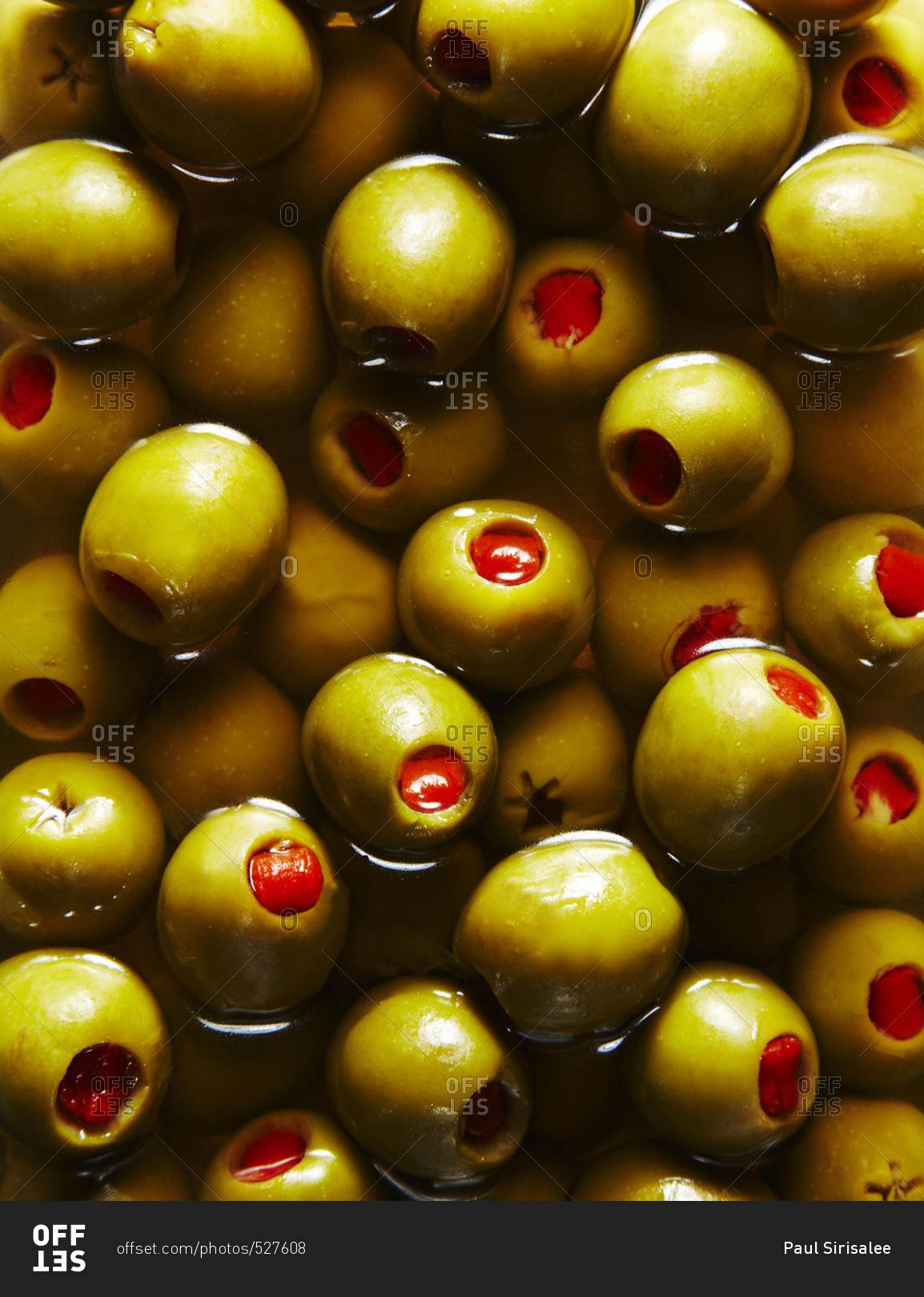 Olives in liquid in close up stock photo OFFSET