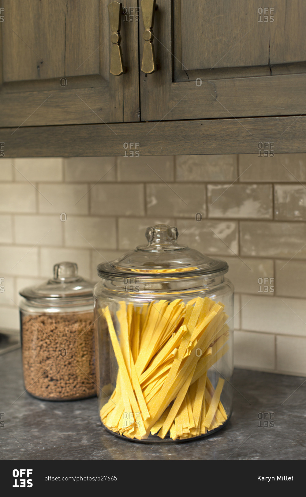 Dried noodles in glass canister on counter
