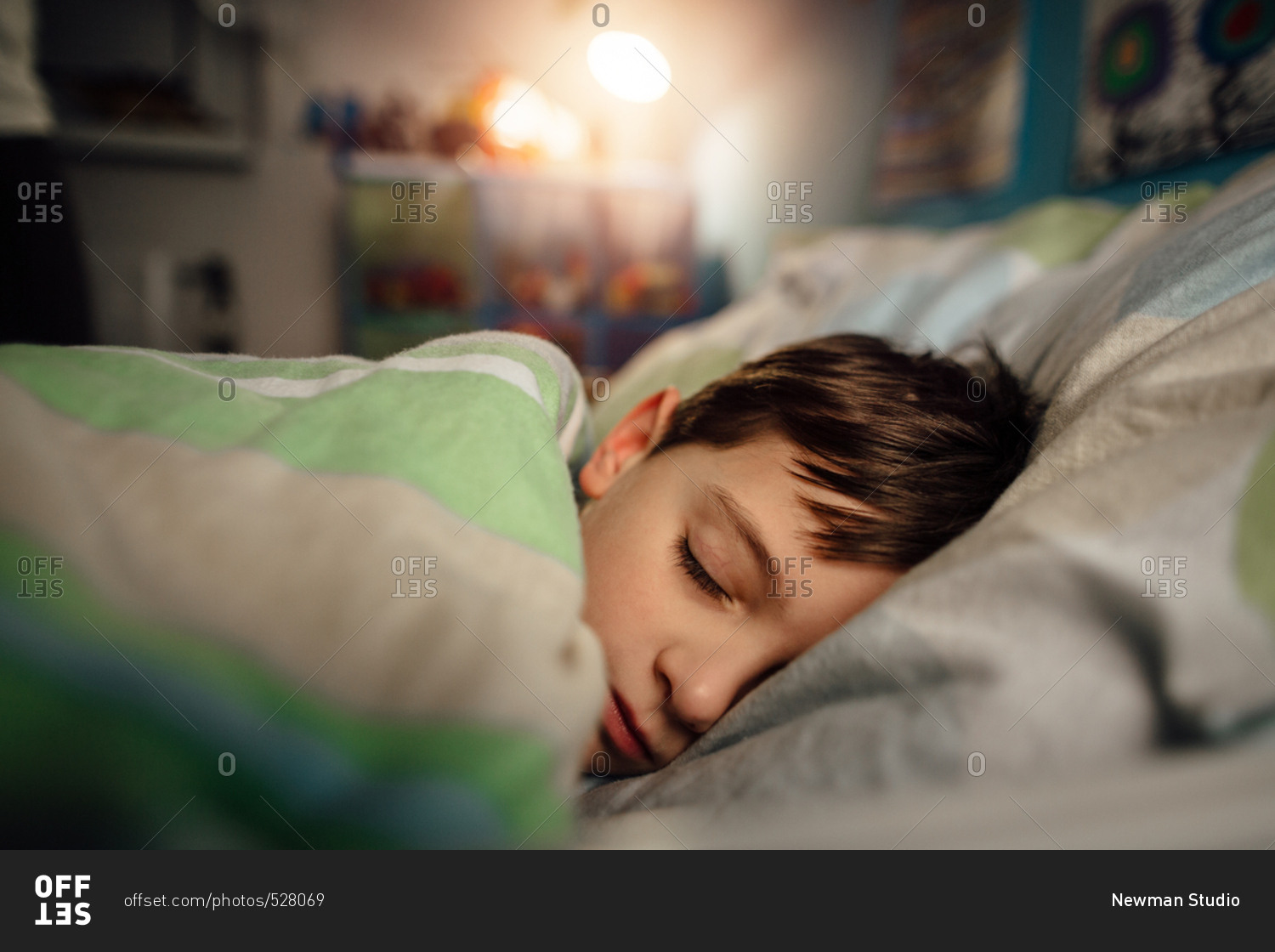 tired-sick-child-sleeping-in-a-bed-in-his-bedroom-stock-photo-offset