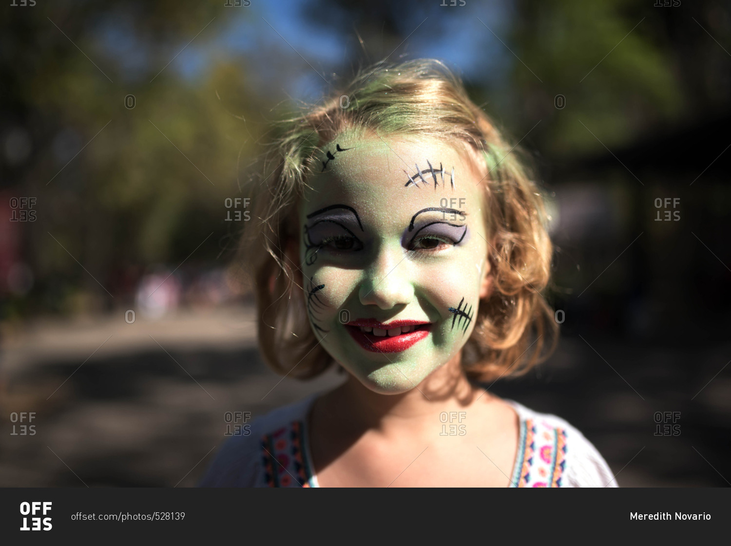 Girl with Frankenstein face paint stock photo OFFSET