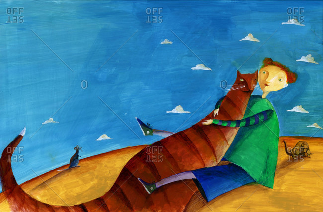 Woman hugging a large orange cat on hill