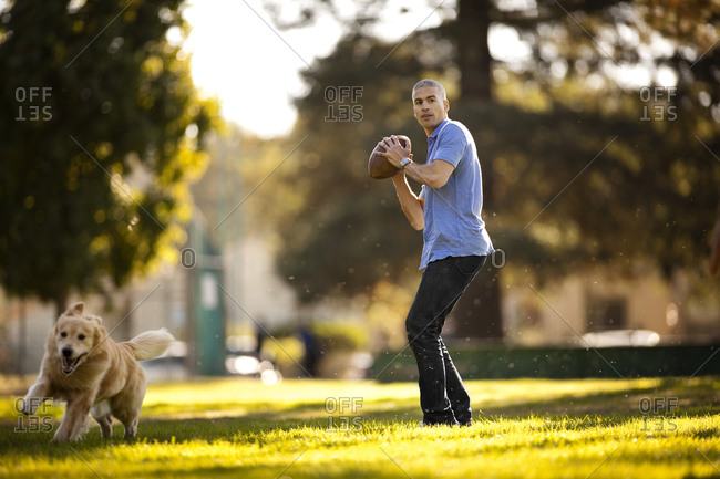 Man Playing Fetch With His Dog Stock Images Page Everypixel