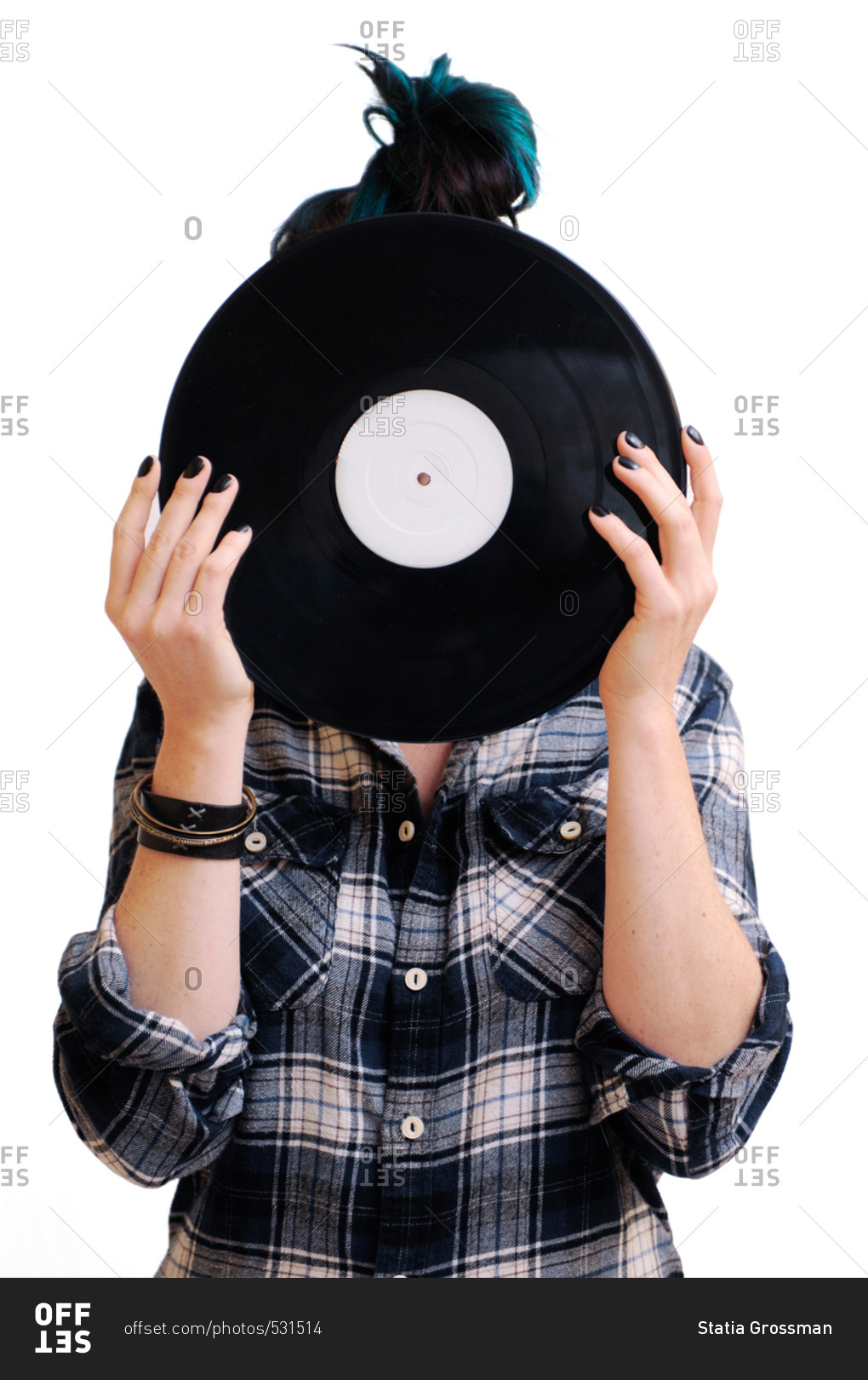 Girl holding a record in front of her face