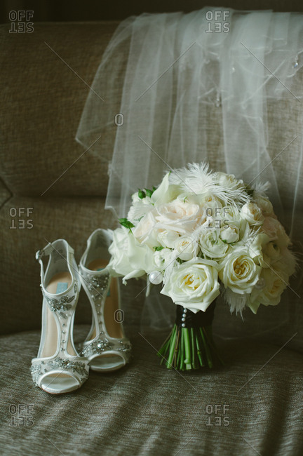 White floral bouquet by high heels