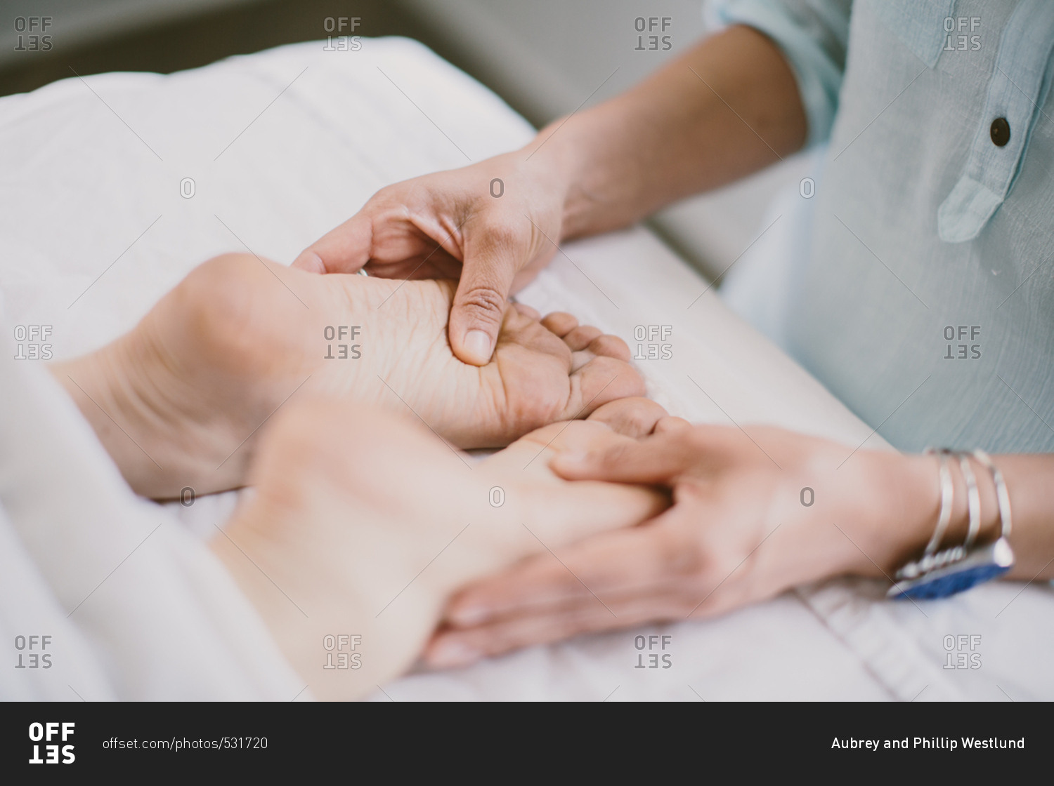 Masseuse giving a foot massage