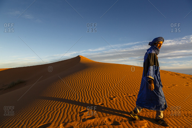 Merzouga, Morocco - November 24, 2016: Tuareg man at the Erg Chebbi sand dunes, Sahara Desert