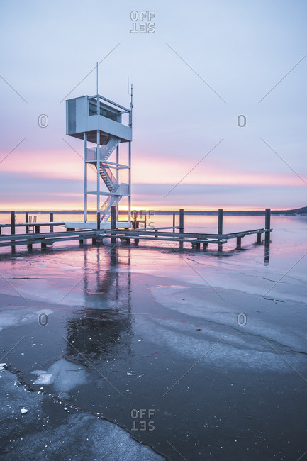 Germany- Berlin- Mueggelsee with diving tower in winter at sunrise