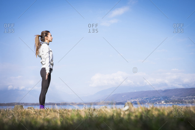 Woman standing at a lake