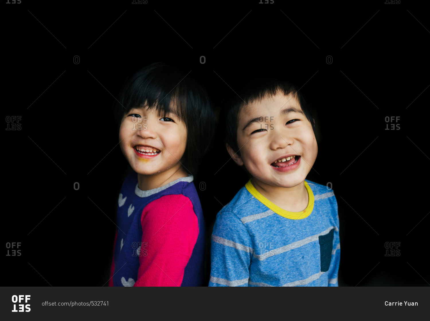 Fraternal twins smiling together