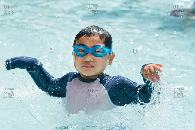 T-shirt and goggles in pool stock photo 