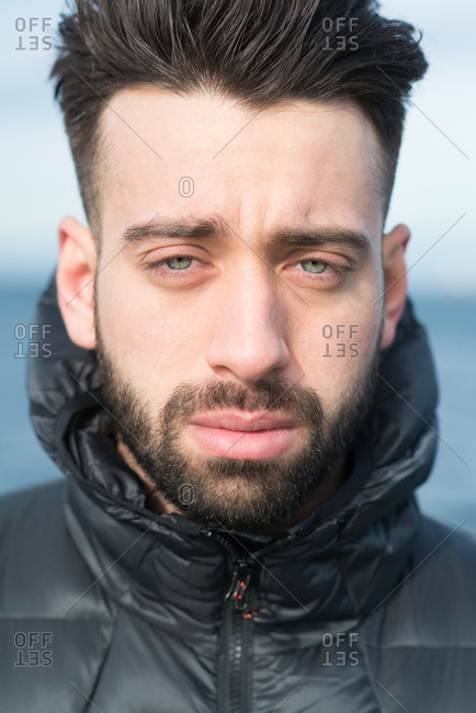 good looking man with blue eyes and dark brown hair