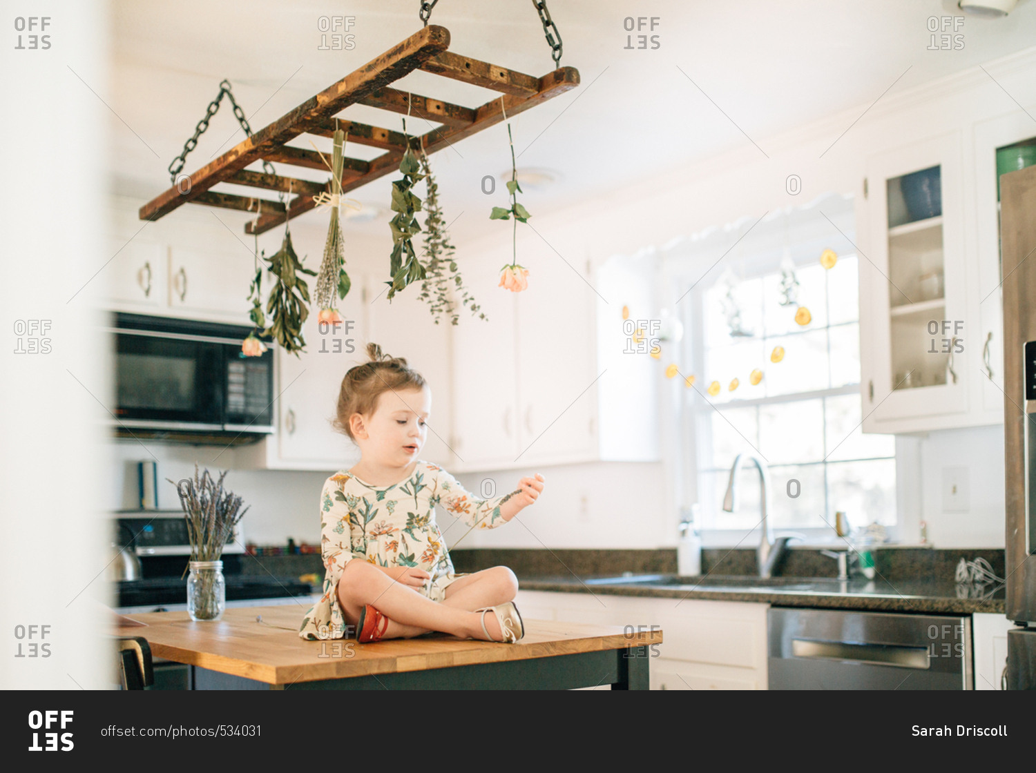 Girl in kitchen looking at lavender