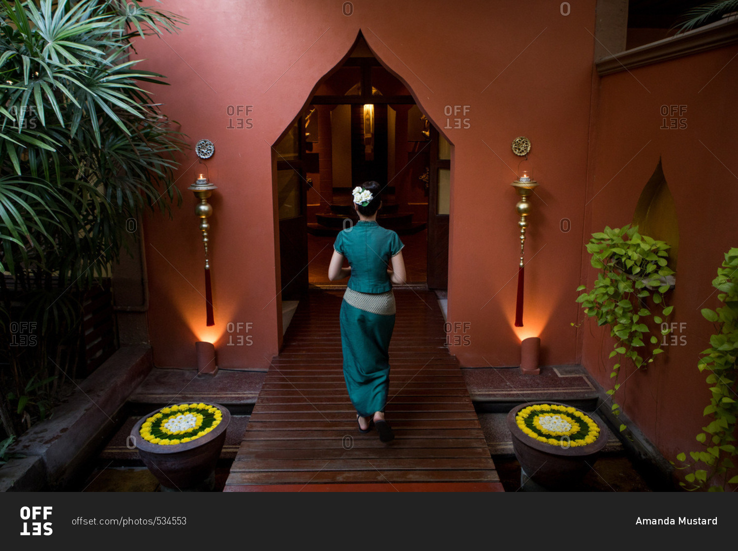Woman walking into a health and massage spa in Chiang Mai, Thailand