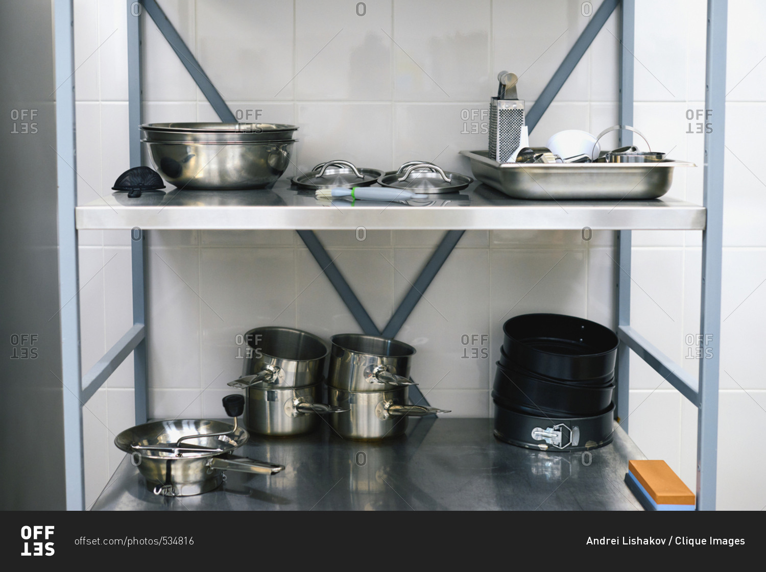 Restaurant Kitchen Metal Shelves utensil in restaurant kitchen: steel saucepans, bowls, covers and Restaurant Kitchen Metal Shelves utensil in restaurant kitchen: steel saucepans, bowls, covers and