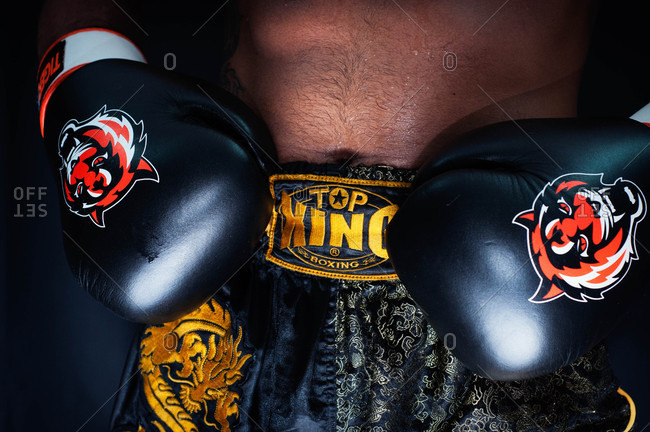 Muscat, Oman - August 7, 2013: Close-up of boxer's waist and gloves