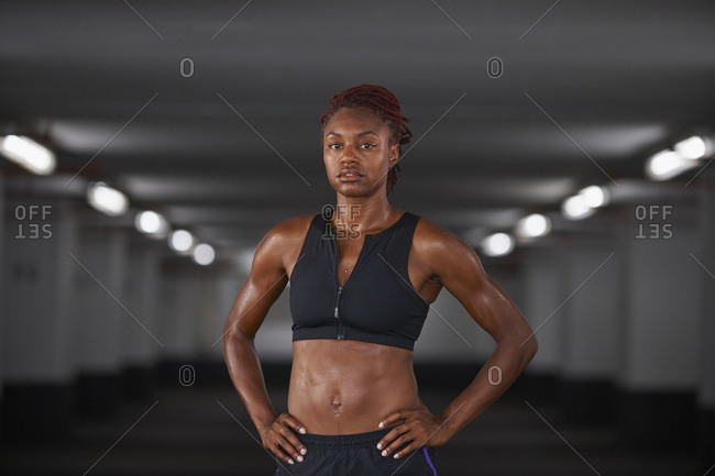 Portrait of Black woman sweating in parking garage