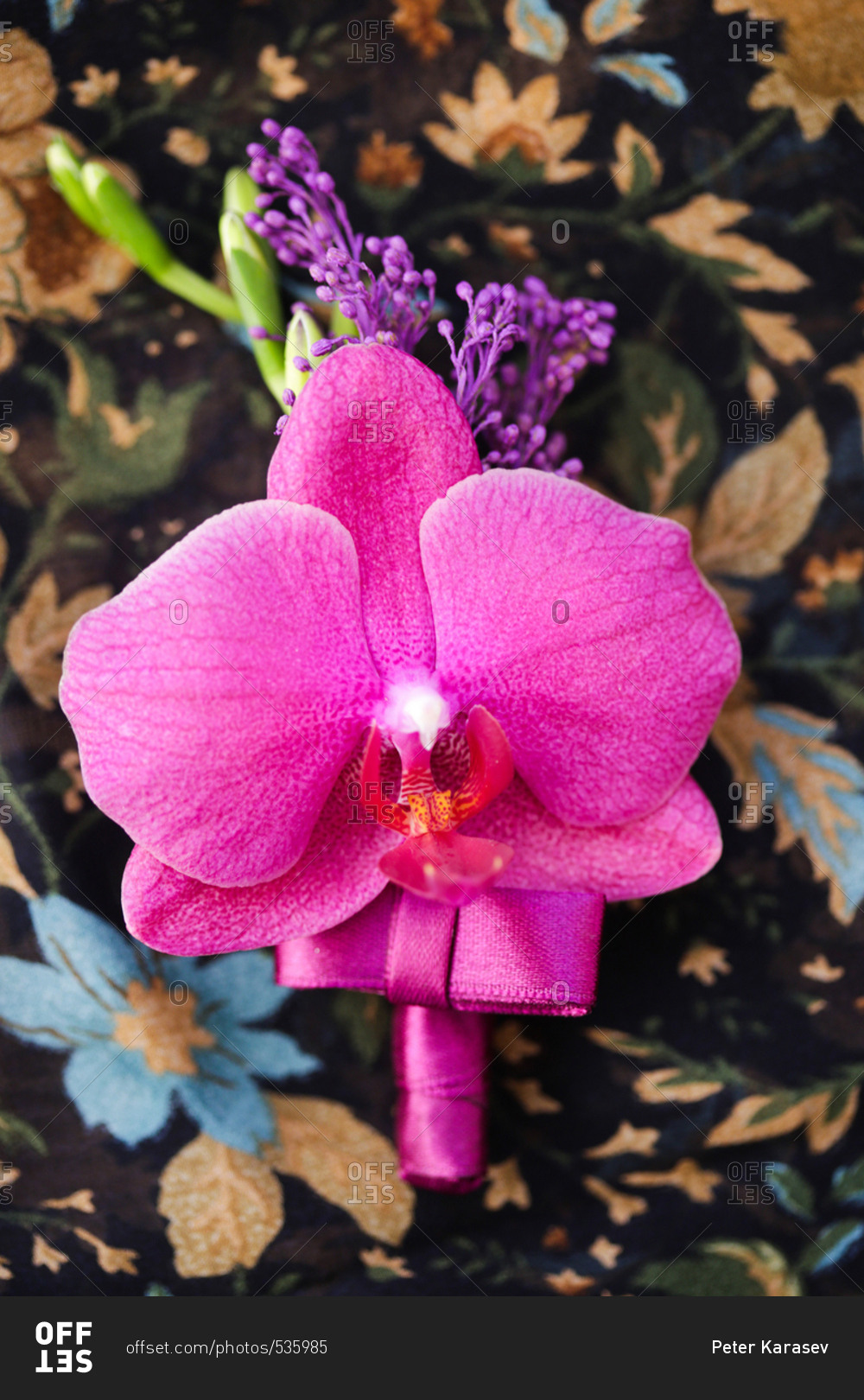 A purple orchid boutonniere