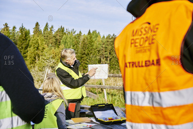 Sweden, Uppland, Rison, Volunteers helping emergency services find missing people