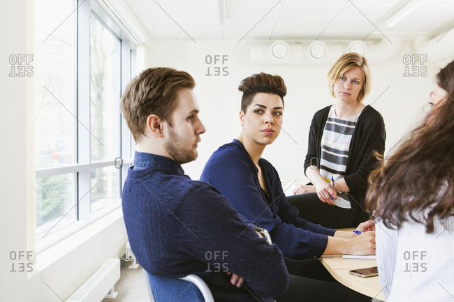 Sweden, Young people sharing ideas during board meeting