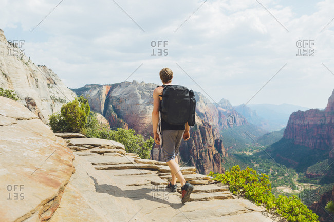 USA, Utah, Man hiking in Zion National Park