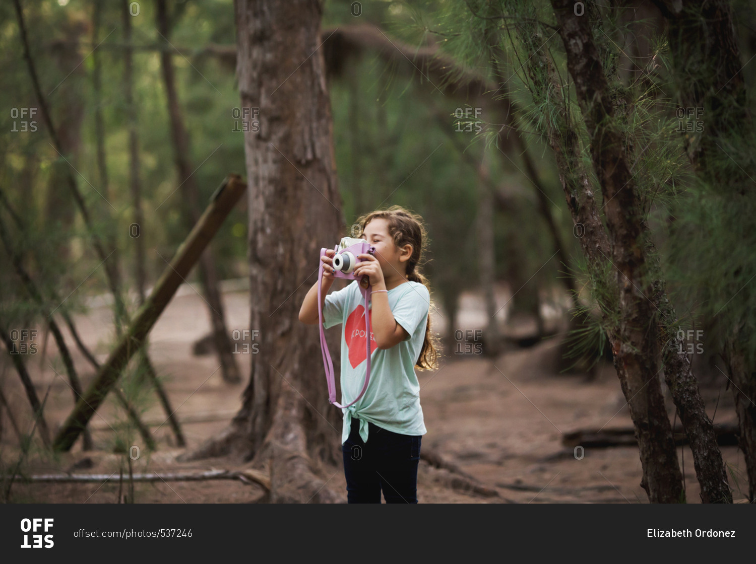 Young girl photographing while on a nature adventure