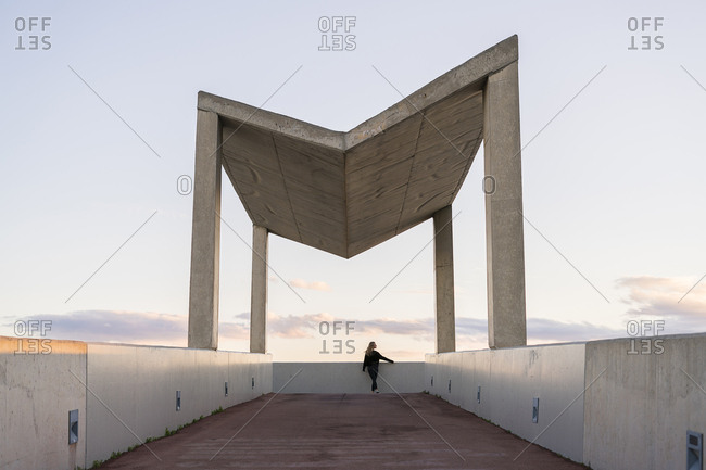 Spain - Barcelona - back view of young woman looking at distance