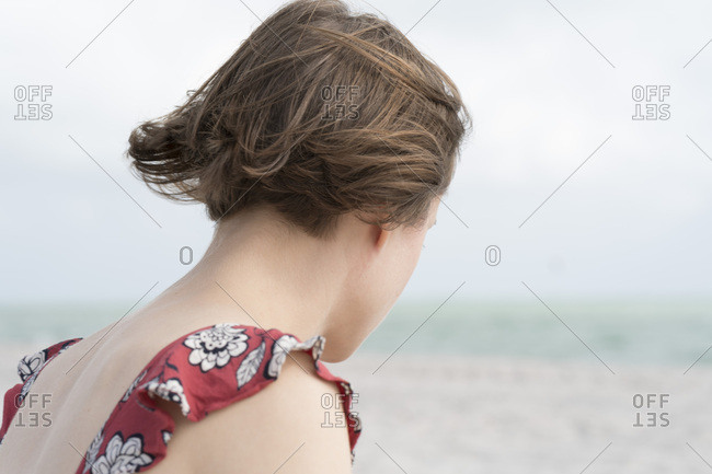 Brown haired woman in coastal breeze