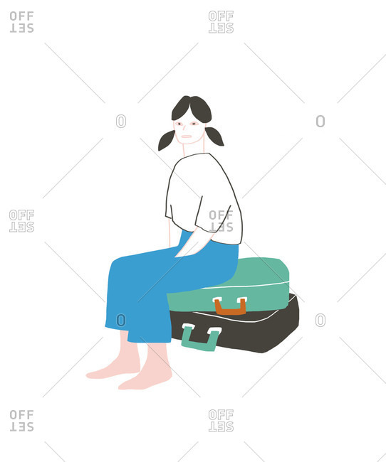 Girl sitting on suitcases