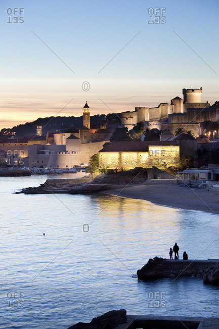 Banje beach at dusk and the city walls