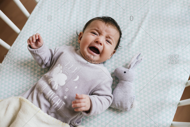 Baby cries 2024 in crib