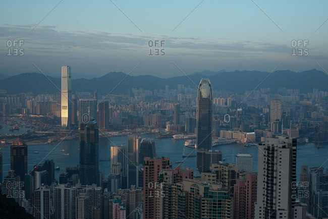 Hong Kong - December 23, 2014: Panoramic view of spectacular Hong Kong skyline and Victoria harbor