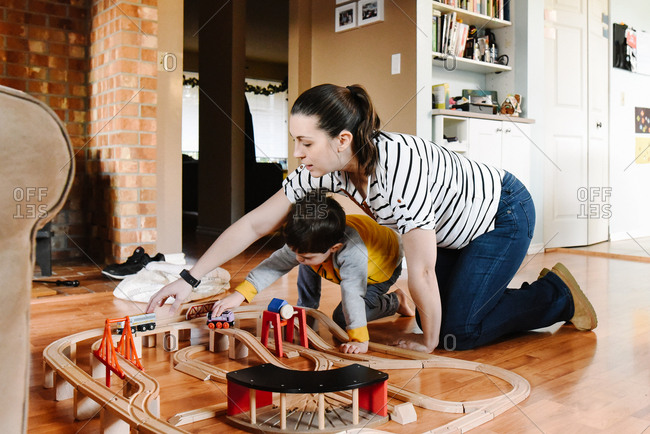Mother plays trains with son