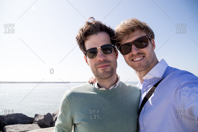 Young caucasian men on pier