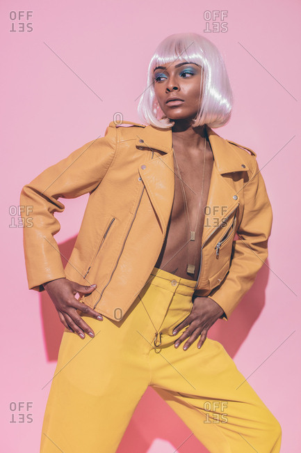 Model in leather coat and white wig