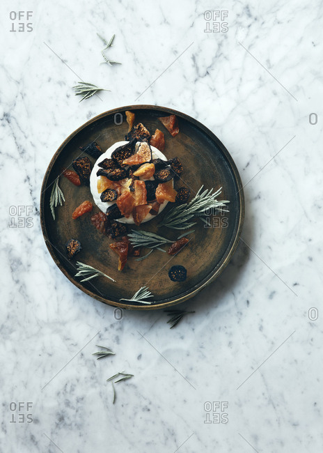 Plate of fresh cheese with dried fruits