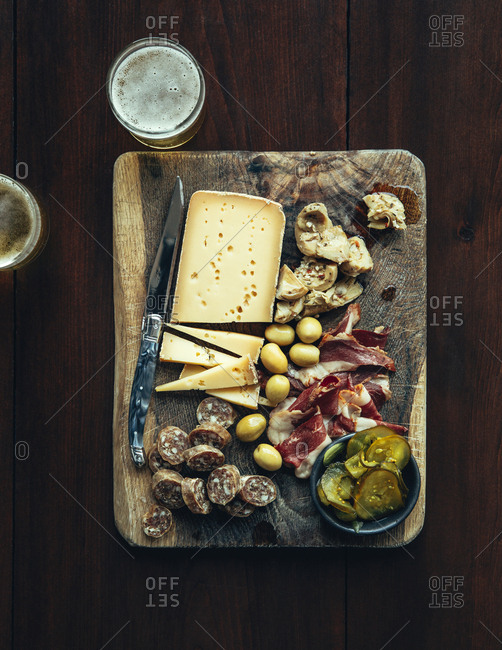 Antipasto prepared on a wooden cutting board
