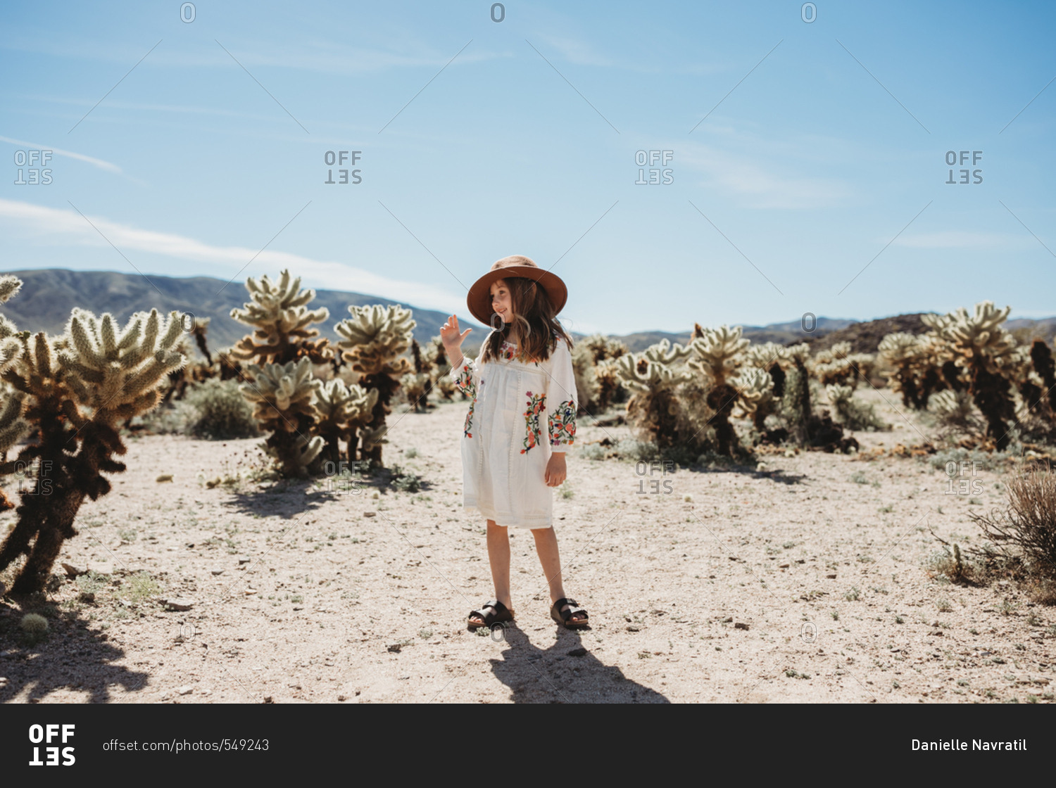 Young girl walking through the desert in Joshua Tree National Park