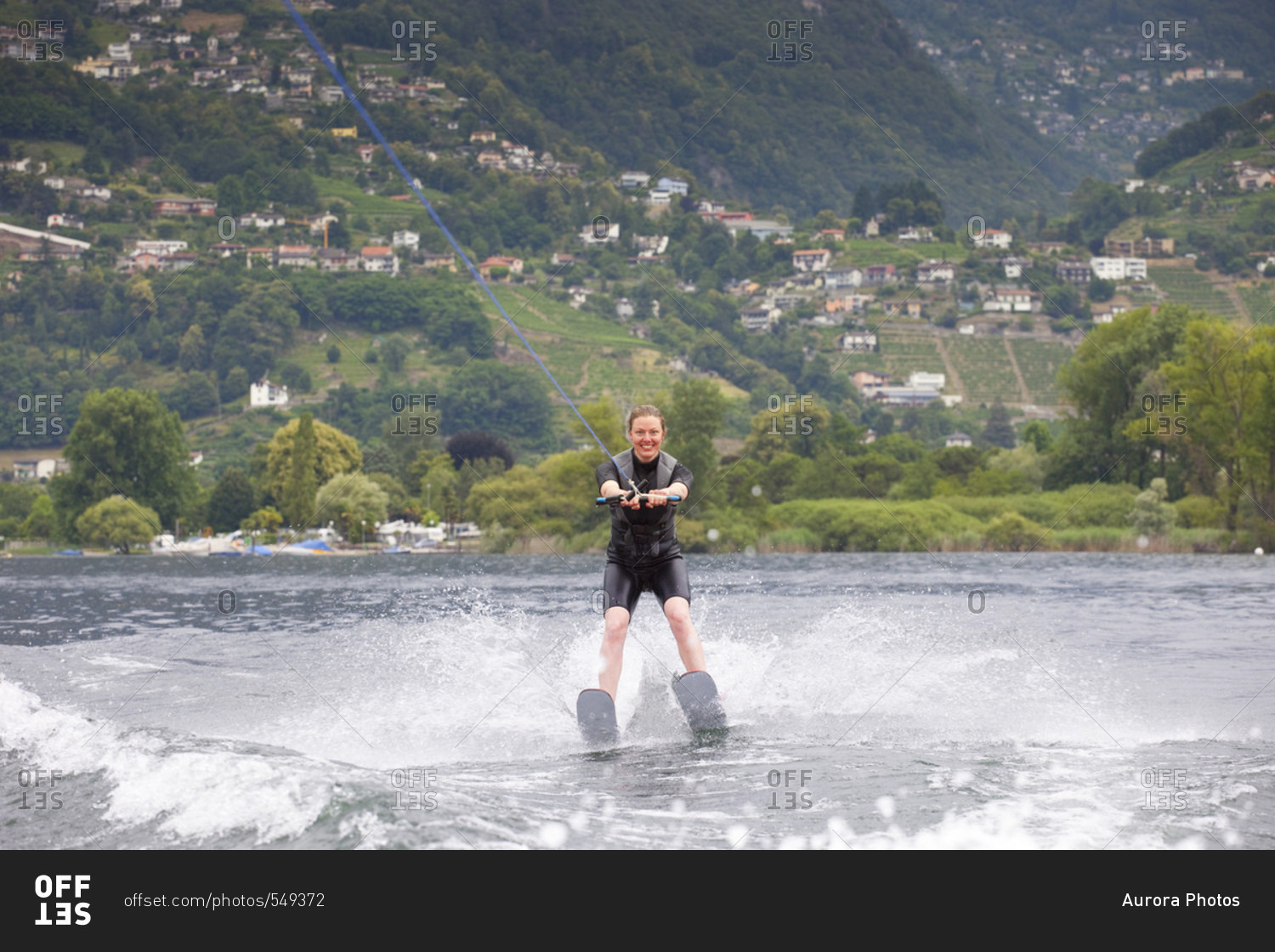 A Smiling Female Water Skiing On Lake Maggiore, Canton Ticino