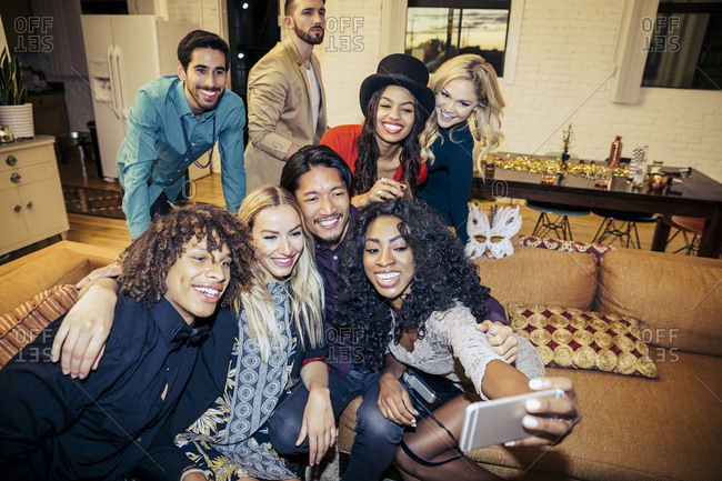 Happy Young Woman Taking Selfie With Friends At House Party Stock Images Page Everypixel